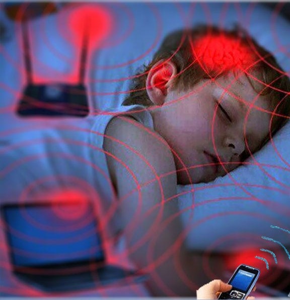 How to reduce your child's exposure to cell phone radiation — sleeping baby surrounded by wireless signals